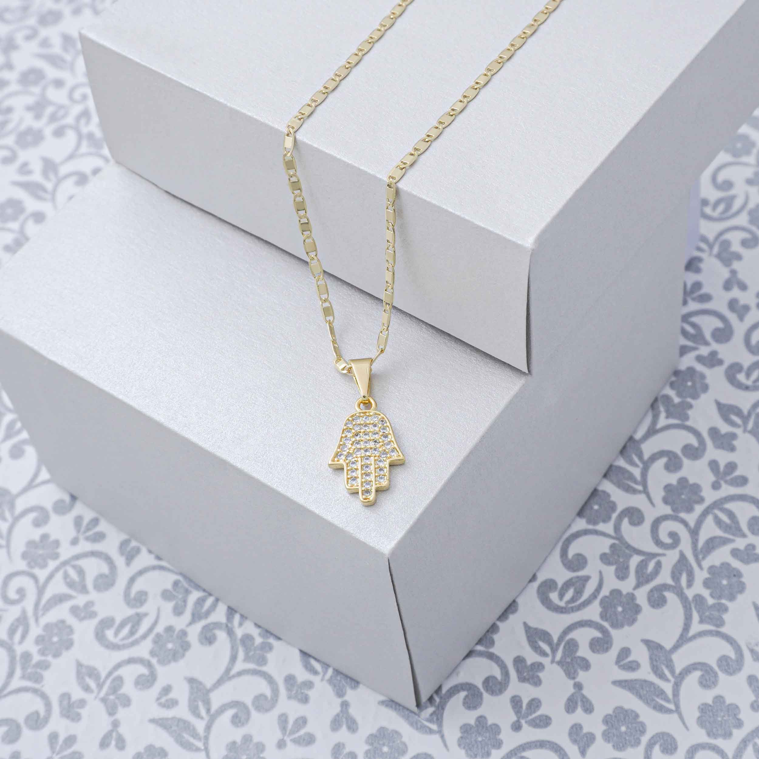 Dije oro laminado 18K Mano Hamsa con cirnones Ref 24350